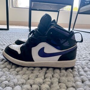 Kids purple and white high top Jordan’s